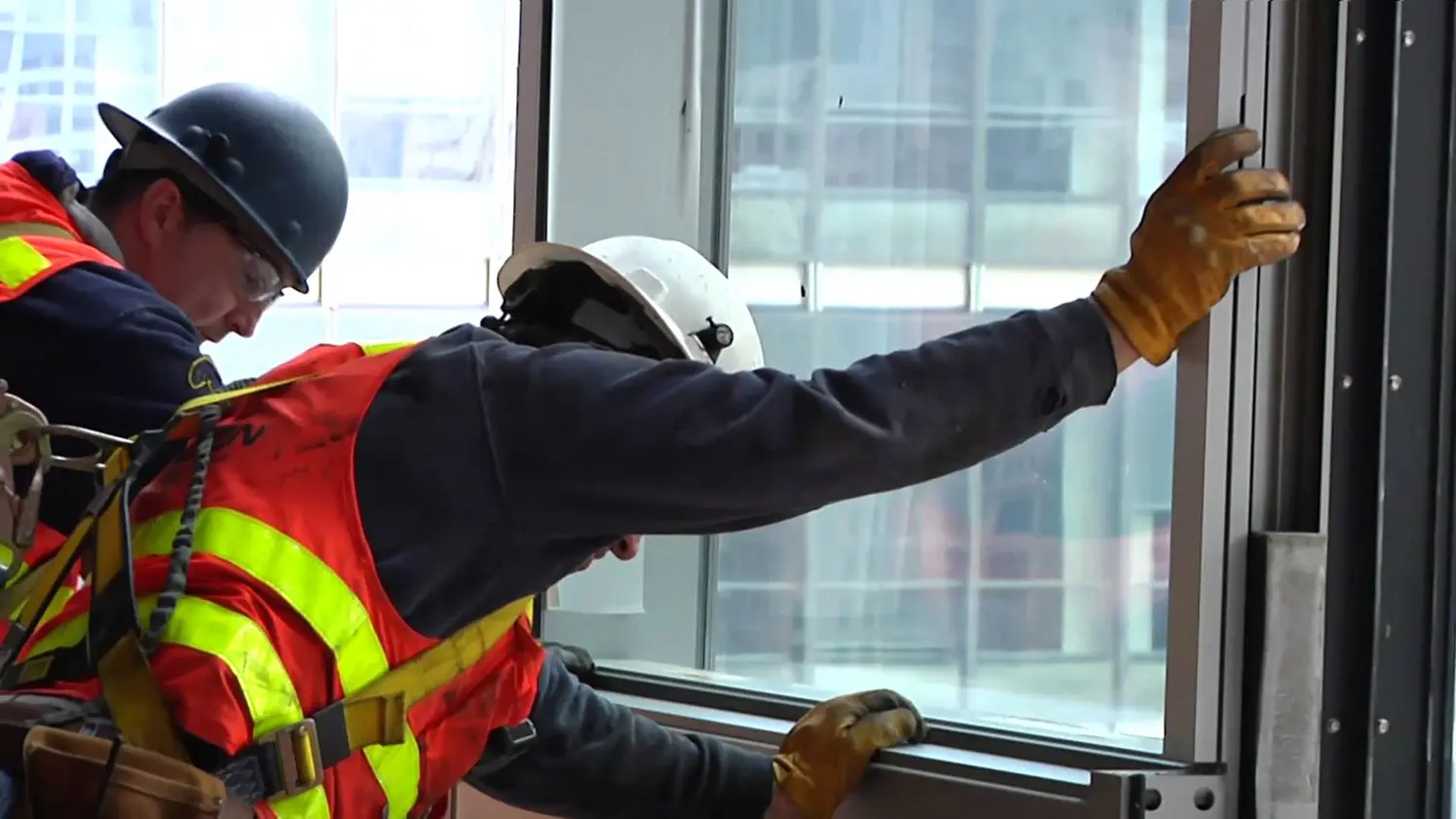 Commercial glass installation technician at work in Southern California